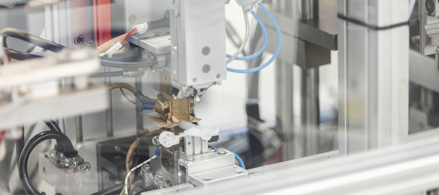 Closeup view of a machine in Specialplast's production.